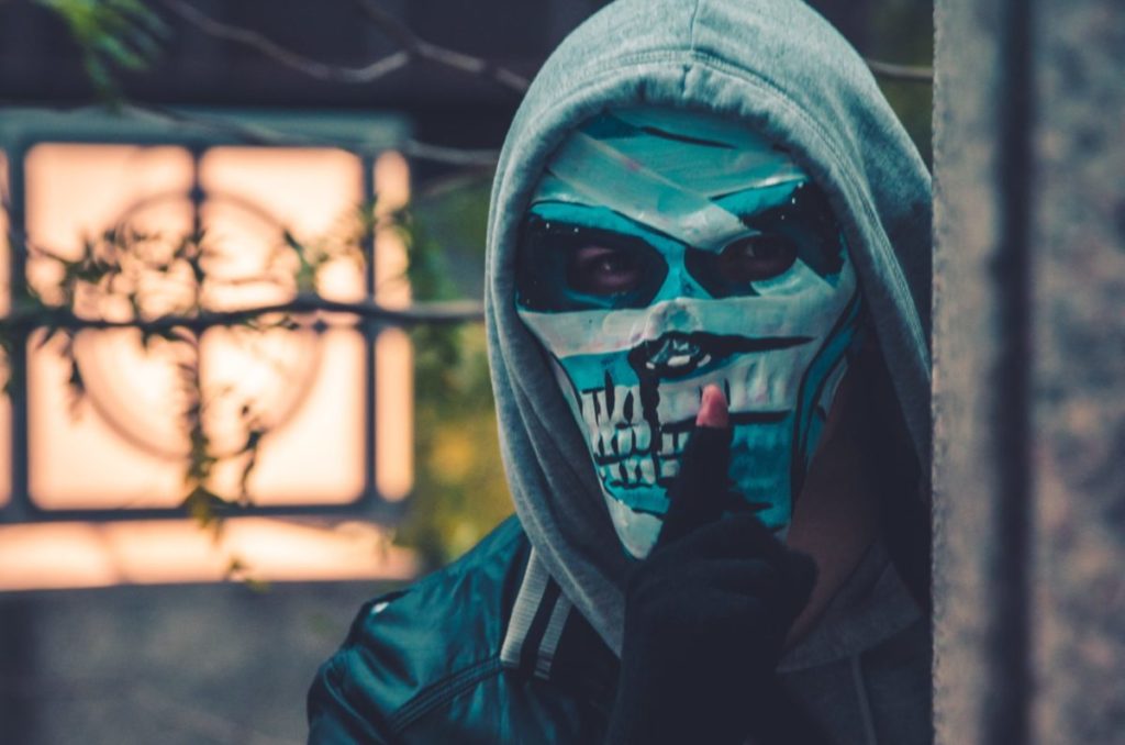 photo of person wearing mask near barbed wire